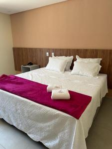 Una cama o camas en una habitación de Premium Hotel