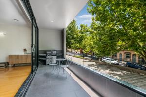 a room with a large window with a view of a street at Serpentine Park on View in Bendigo