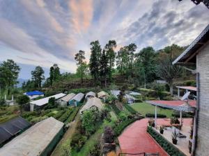 an overhead view of a farm with a garden and buildings at Aaravi Garden Homestay in Kalimpong