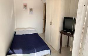 TV a/nebo společenská místnost v ubytování Veranera Hostal