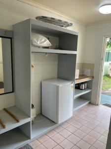 a room with a white cabinet in a kitchen at The Park Motel in Charters Towers