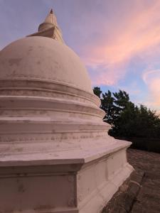 a white building with a dome on top of it at Little Pumpkin Cabanas in Tangalle