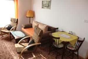 a living room with a couch and a table at Apartment Příbram in Příbram