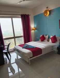 Ένα ή περισσότερα κρεβάτια σε δωμάτιο στο GM Hospitality Services pune