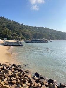 a large boat is docked at a beach at 馬港驛站 Oldharbor Hostel in Nangan
