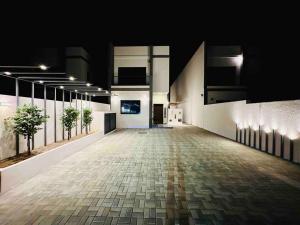 an empty hallway of a building at night at Ocean View Villa in Fujairah