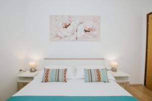Ένα ή περισσότερα κρεβάτια σε δωμάτιο στο Apartments Civadelić