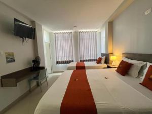 Voodi või voodid majutusasutuse HOTEL MAGIC toas