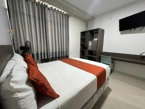 Voodi või voodid majutusasutuse HOTEL MAGIC toas