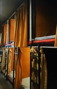 a row of bunk beds in a room at Rubikz Hostel & Cafe in Surabaya
