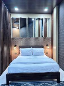 Spacious Apartment in Catalunan, Davao tesisinde bir odada yatak veya yataklar