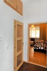 a room with a door leading to a bedroom at Apartment near the Old Town Square in Prague