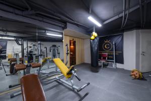 a gym with treadmills and equipment in a room at Canka Hotel in Istanbul