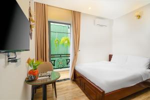 Posteľ alebo postele v izbe v ubytovaní Nguyên Hương Hotel
