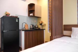 Kuchyň nebo kuchyňský kout v ubytování Nguyên Hương Hotel
