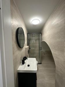 a bathroom with a sink and a shower at House Old Town Dubrovnik in Dubrovnik
