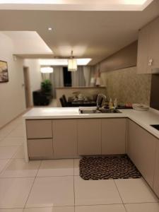 a kitchen with a sink and a counter top at Royal Suite in Kuala Lumpur