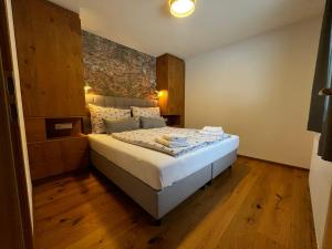 Posteľ alebo postele v izbe v ubytovaní Apartments Hohenberger Mallnitz - Mein Platz in den Bergen!