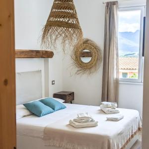 Postel nebo postele na pokoji v ubytování Arya Room Villasimius