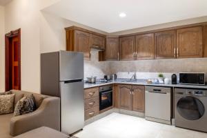 A cozinha ou kitchenette de Somerset Al Mansoura Doha