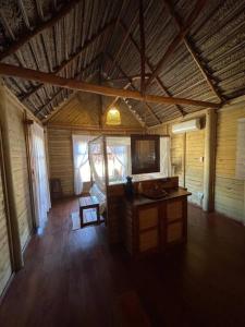 an inside view of a room in a cabin at Cheerful 3-bedroom holiday beach cabin. in Inhambane