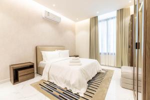 Postel nebo postele na pokoji v ubytování Amber Hospitality - Al Qairawan