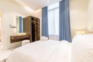 Postel nebo postele na pokoji v ubytování Amber Hospitality - Al Qairawan