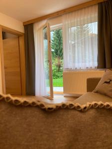 Posteľ alebo postele v izbe v ubytovaní Apartments Hohenberger Mallnitz - Mein Platz in den Bergen!