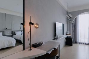 En eller flere senger på et rom på Terumahouse 照間