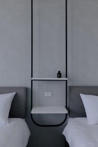 En eller flere senger på et rom på Terumahouse 照間