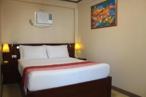 P&M Final Option Beach Resort客房内的一张或多张床位