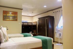 P&M Final Option Beach Resort客房内的一张或多张床位