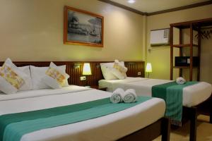 P&M Final Option Beach Resort客房内的一张或多张床位