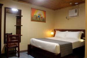 P&M Final Option Beach Resort客房内的一张或多张床位