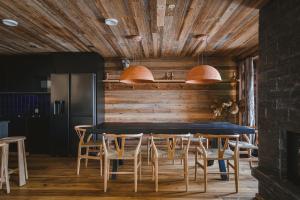 a dining room with a table and chairs at Jänkä Townhouse in Levi