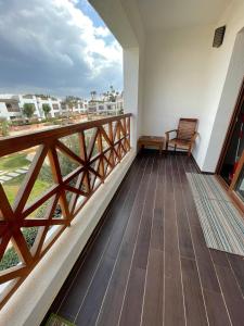 a balcony with a bench and a view of the ocean at Sheikh coast in Sharm El Sheikh