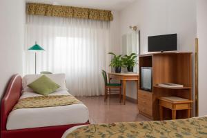Postel nebo postele na pokoji v ubytování 5Miglia Hotel & Spa