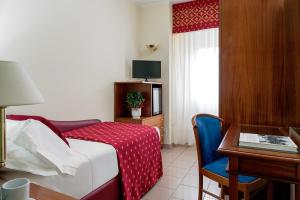 TV a/nebo společenská místnost v ubytování 5Miglia Hotel & Spa