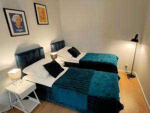 Posteľ alebo postele v izbe v ubytovaní Hugo VIP Apartments