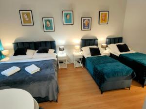 Posteľ alebo postele v izbe v ubytovaní Hugo VIP Apartments