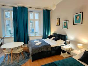 Posteľ alebo postele v izbe v ubytovaní Hugo VIP Apartments