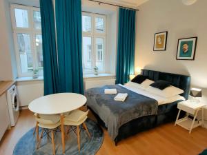 Posteľ alebo postele v izbe v ubytovaní Hugo VIP Apartments
