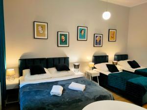 Posteľ alebo postele v izbe v ubytovaní Hugo VIP Apartments