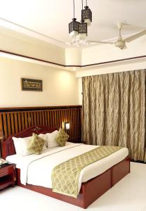 a bedroom with a large bed in a room at Hotel Mera Mann in Lucknow