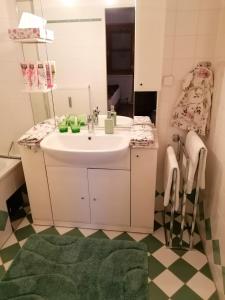 a bathroom with a sink and a mirror at Summer Wine romantisches, fahrradfreundliches Weinbergidyll mit Traumausblick gleich neben Buschenschank! in Leutschach +27 photos