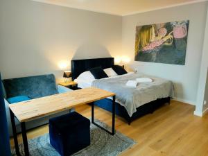 Posteľ alebo postele v izbe v ubytovaní Hugo VIP Apartments