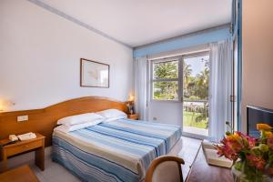 Postel nebo postele na pokoji v ubytování Villa Dei Principi Hotel + 37 fotografií