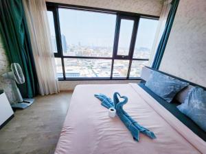 Cama o camas de una habitación en 泰国芭提雅thebase无边游泳池公寓