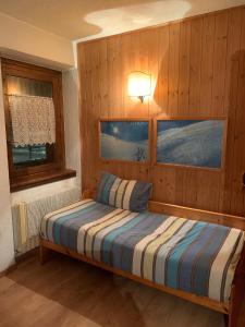 Кровать или кровати в номере Livigno Nest