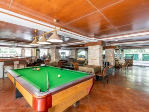 a pool table in the middle of a room at Royal Ivory Sukhumvit Nana in Bangkok